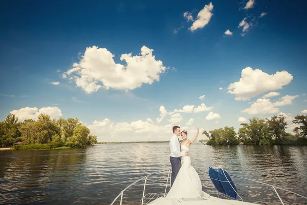 Bride and groom on the boat — Stock Photo, Image