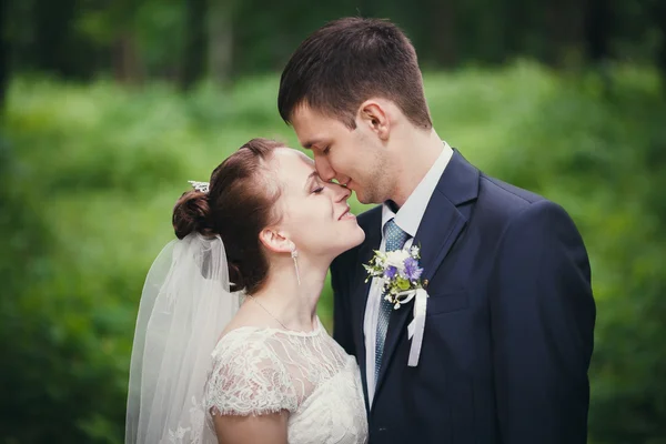 bride and groom in the park