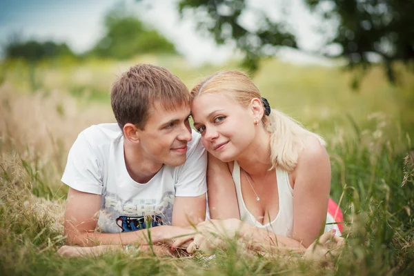 Close-up, couple lying on the grass — Stock Photo, Image