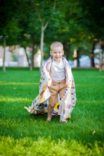 Boy playing with a cloak — Stock Photo, Image