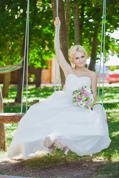 Bride on a swing — Stock Photo, Image