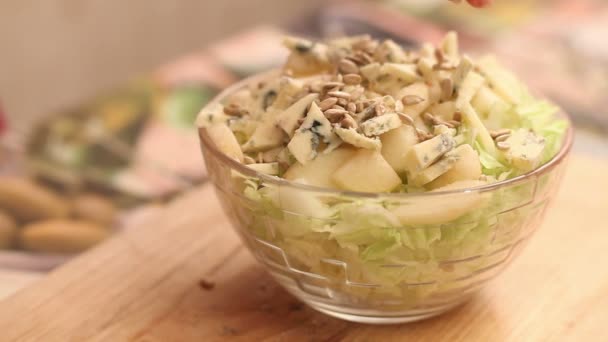 Cooking vegetable salad, sunflower seeds — Stock Video