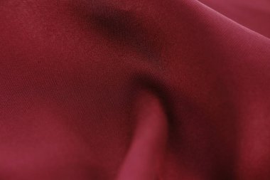 Eşsiz ve çekici dokusu olan kırmızı kumaş dokusu tasarım arka planı