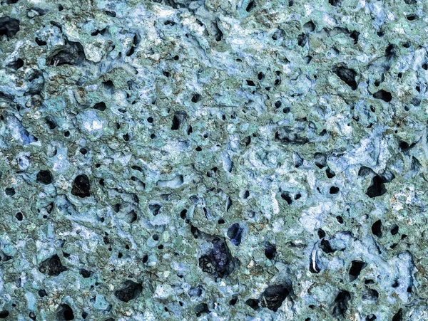 Taş kaplama bir duvar. Sıcak renklerin taş dokusu.