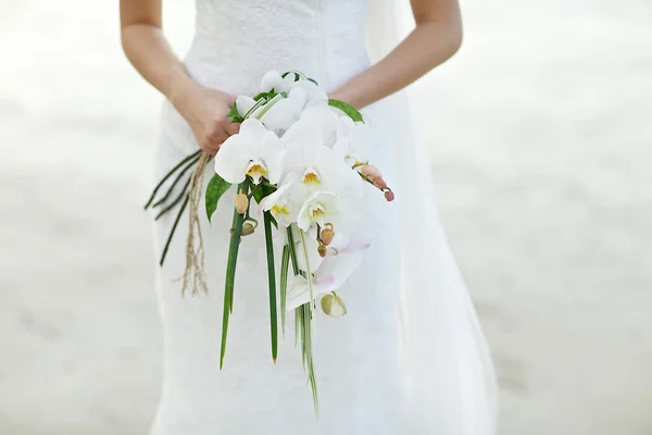 Bride holding white flower wedding bouquet