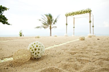 Flower decoration at wedding venue on the beach clipart