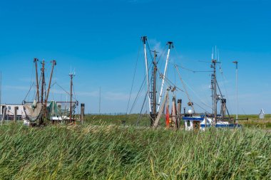Mast superstructure of a shrimp cutter in the natural harbour of Spieka. Spieka is located in East Frisia on the German North Sea coast.