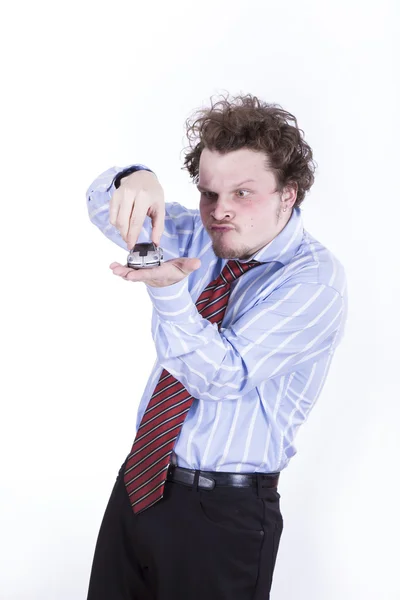 Businessman with miniature car on white background — Stock Photo, Image