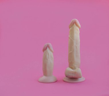 Sex toy vaginal dildo pink on a light background