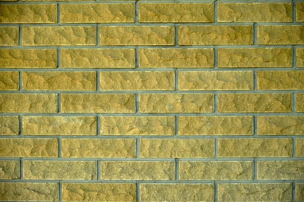Zlatý kámen cihly textura pozadí — Stock fotografie
