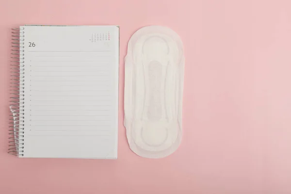 diary with sanitary napkin to know the date of menstrual periods