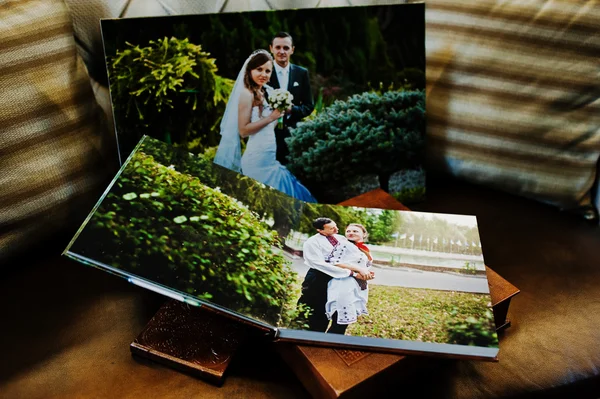 Brown leather wedding book and album with big picture on canvas