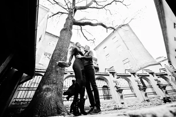 Young beautiful stylish fashion couple in a red dress in love st — Stock Photo, Image