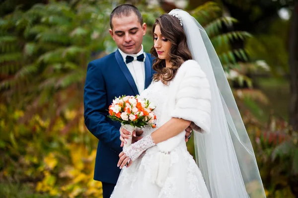 Happy wedding couple in love at autumn park — Stock Photo, Image