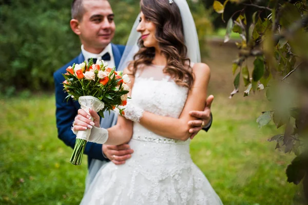 Happy wedding couple in love at autumn park — Stock Photo, Image