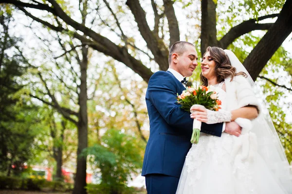Happy wedding couple in love at autumn park — Stock Photo, Image