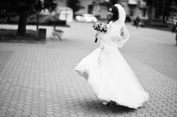 Portrait of charming curly bride in a fur coat — Stock Photo, Image