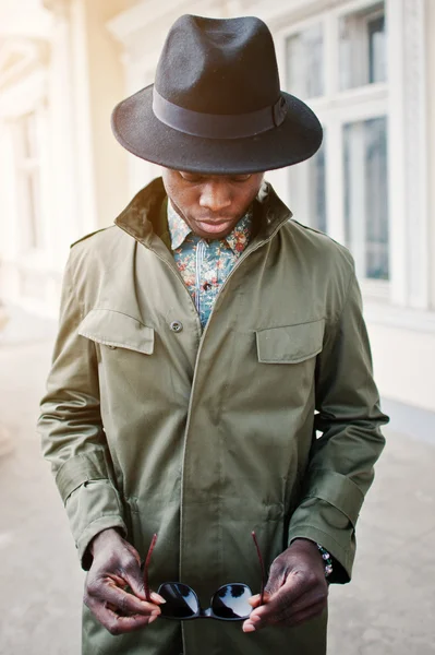 Fashion portrait of black african american man on green coat clo — Stock Photo, Image