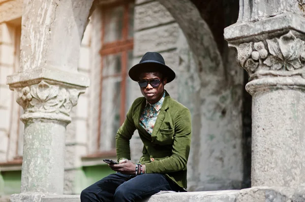 Fashion portrait of black african american man on green velvet j — Stock Photo, Image