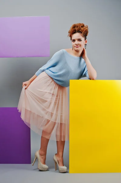 Full length studio portrait of young girl near art colored blank — Stock Photo, Image