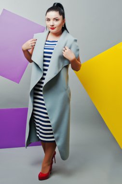 Young woman portrait with blank yellow and purple banner, board 