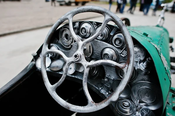 Iron handmade steering wheel at vintage sport car — Stock Photo, Image