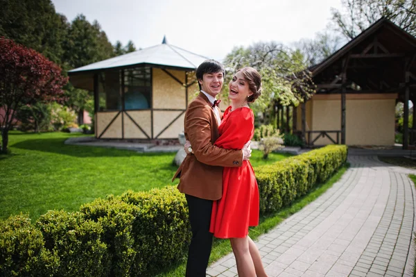 Couple hugging and laughing on camera. Stylish man at velvet jac — Stock Photo, Image