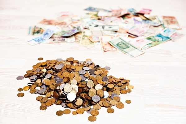 Mountain cents and money on wooden background