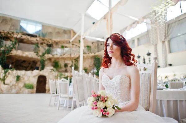 Portrait of charming red-haired bride model with wedding bouquet — Stock Photo, Image