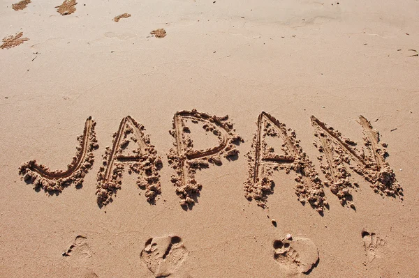 "Japonia "napisane w piasku na plaży — Zdjęcie stockowe