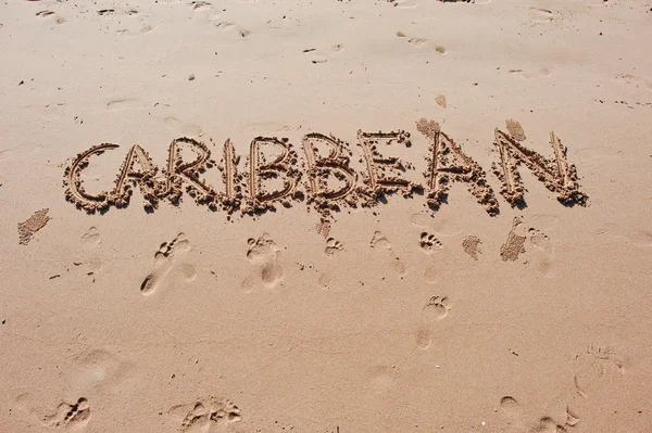 "Karibik "in den Sand am Strand geschrieben — Stockfoto