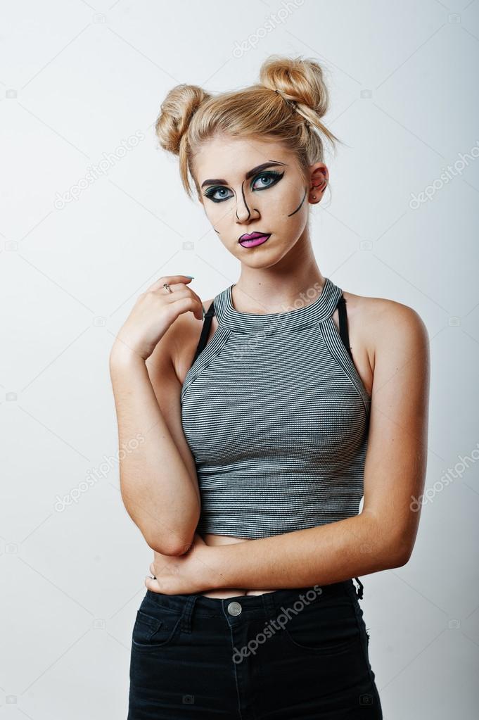 Studio shot of anime girl with bright and colorful makeup on whi