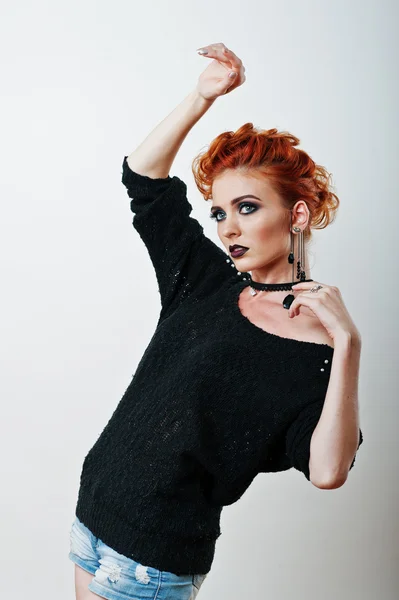 Studio portrait of red haired girl on black blouse and jeans sho — Stock Photo, Image