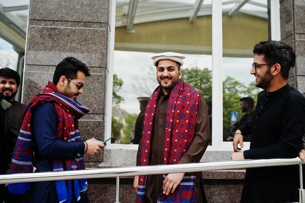 Group of pakistani man wearing traditional clothes salwar kameez or kurta.