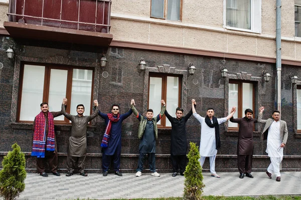 Group of pakistani man wearing traditional clothes salwar kameez or kurta.