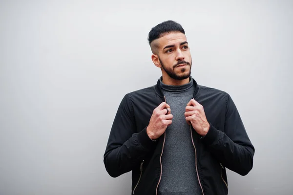 stock image Portrait of stylish arab beard man wear grey turtleneck and black jaket. Arabian model guy against steel wall.