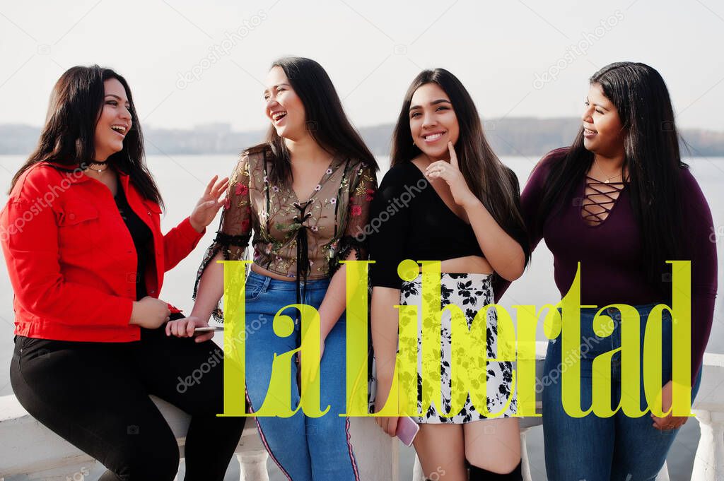 La Libertad city. Group of four happy and pretty latino girls from Ecuador. 