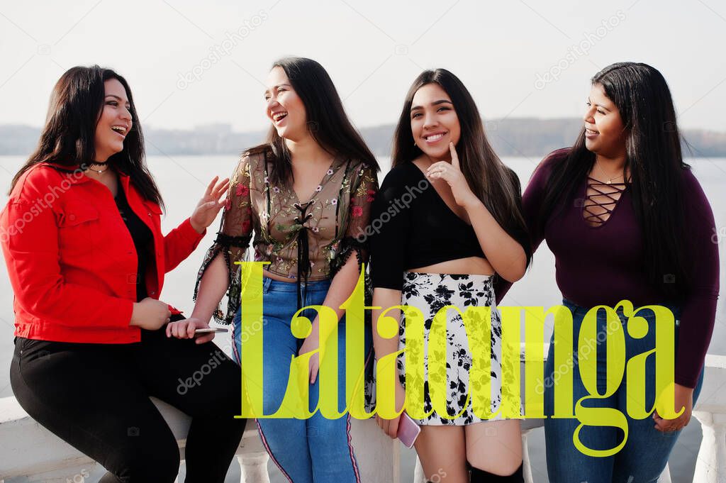 Latacunga city. Group of four happy and pretty latino girls from Ecuador. 