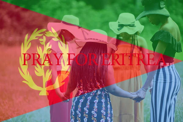 Pray for Eritrea. Group of four african women holding hands and praying. Concept of crisis in Africa country.