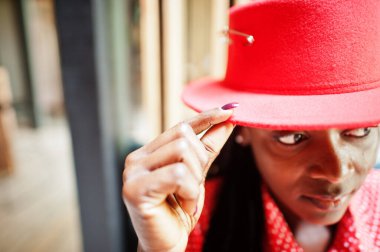 Close up portrait of pretty braids business african american lady bright bossy person friendly wear office red shirt and hat.