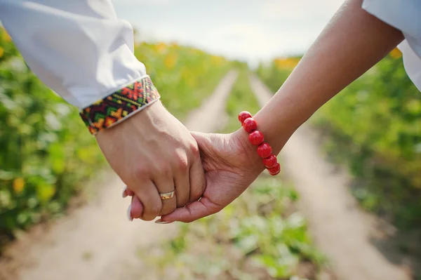 Pair of hands on background trails — Stock Photo, Image