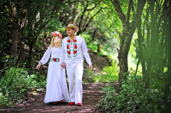 Young  beautiful couple in traditional dress — Stock Photo, Image