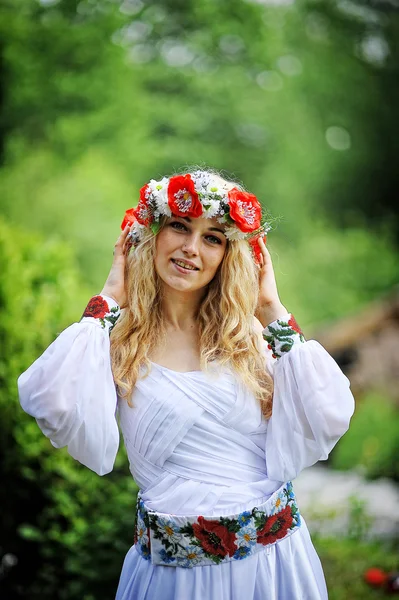 Young  beautiful blonde girl in traditional dress — Stock Photo, Image