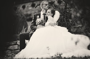 young happy wedding couple at the nice nature 