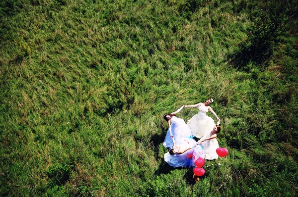 Funny brides holding hands , view from helicopter — Stock Photo, Image