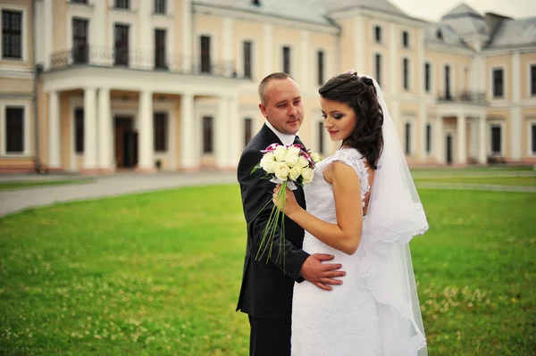 Wedding  adult couple in the courtyard of castle — Stock Photo, Image