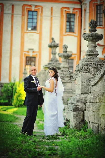 Wedding  adult couple in the courtyard of castle — Stock Photo, Image