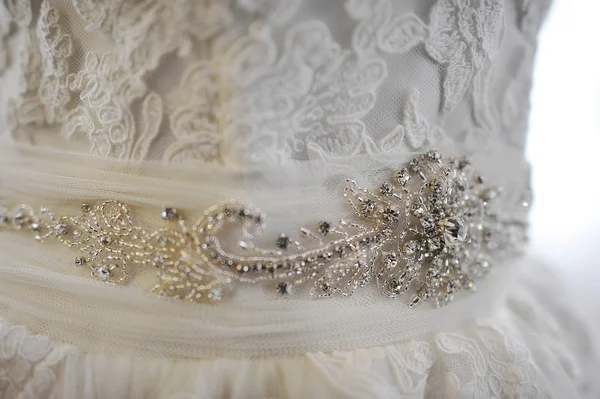 Brooch on white wedding dress — Stok fotoğraf