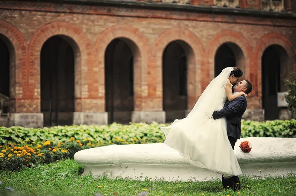 Newlyweds background  old brick architecture house and tower — Stock Photo, Image