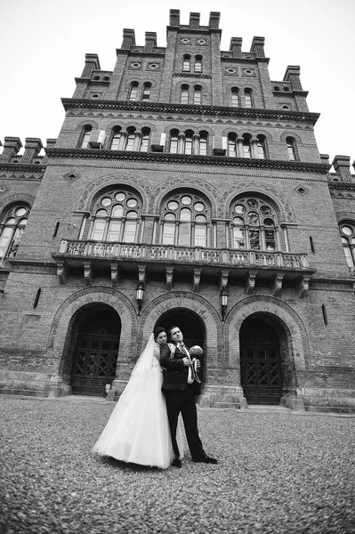 Newlyweds background  old brick architecture house and tower — Stock Photo, Image